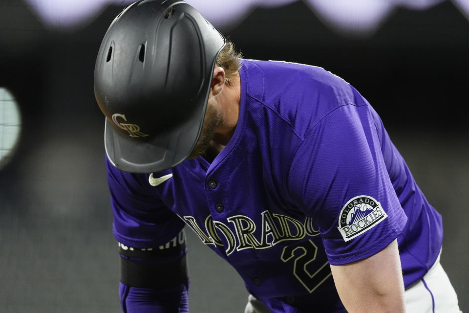 Colorado Rockies' Ryan McMahon reacts after grounding into a double play against San Diego Padres relief pitcher Robert Suarez to end the ninth inning of a baseball game Monday, April 22, 2024, in Denver. (AP Photo/David Zalubowski)