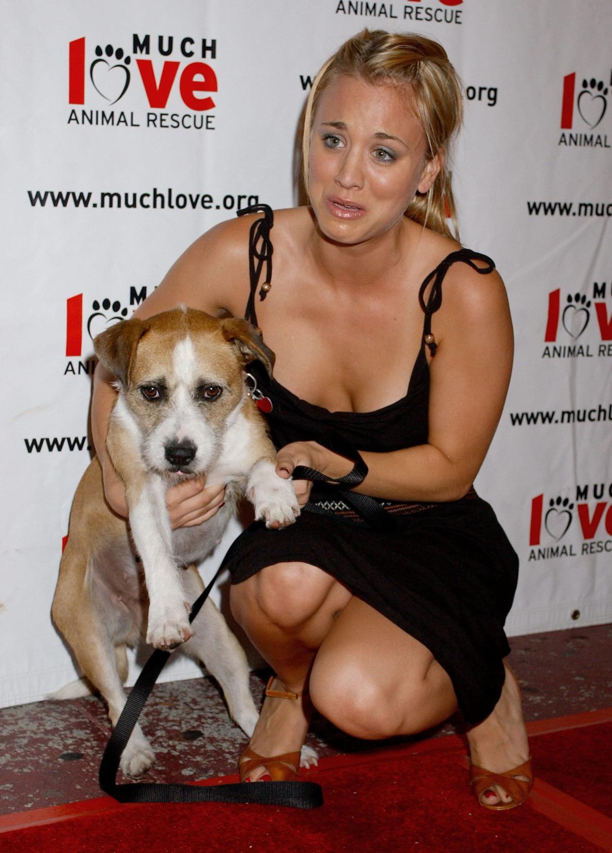 Kaley Cuoco holding a dog