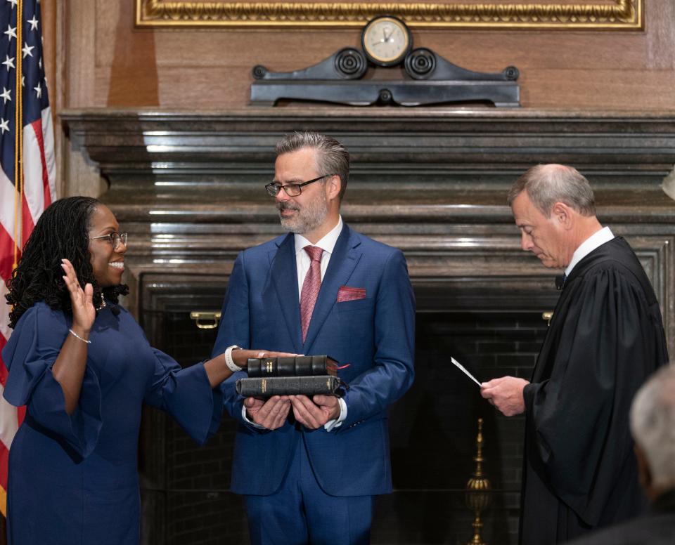 Chief Justice John G. Roberts, Jr., administers the Constitutional Oath to Judge Ketanji Brown Jackson in the West Conference Room, Supreme Court Building. Dr. Patrick Jackson holds the Bible.