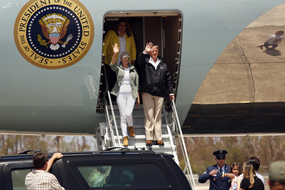 U.S. President Donald Trump and the first lady Melania Trump arrive at the Muniz Air National Guard Base in Puerto Rico on Tuesday. (Photo: Carolyn Cole via Getty Images)