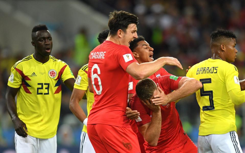 Jordan Henderson reacts after being headbutted by Wilmar barrios