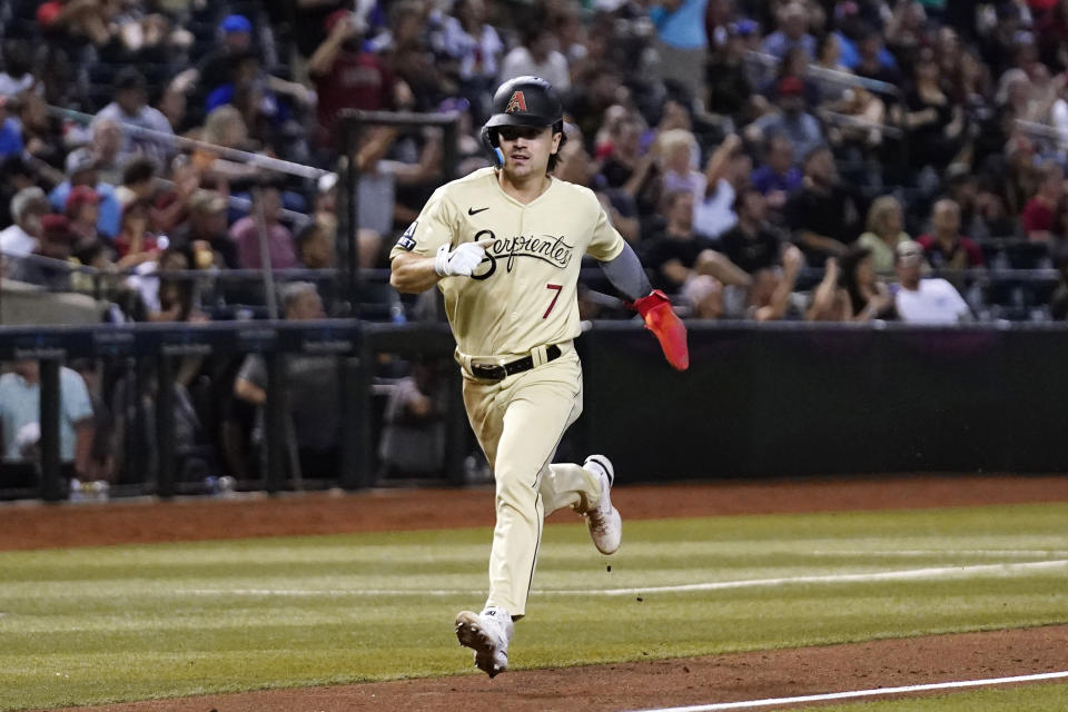 Arizona Diamondbacks' Corbin Carroll heads home to score against the Pittsburgh Pirates during the sixth inning of a baseball game Friday, July 7, 2023, in Phoenix. (AP Photo/Ross D. Franklin)