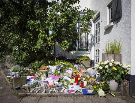 Flowers are laid in front of the house of a family who were all killed in Thursday's Malaysia Airlines Boeing 777 plane crash, in Neerkant, near Eindhoven July 19, 2014. REUTERS/Mischa Rapmund