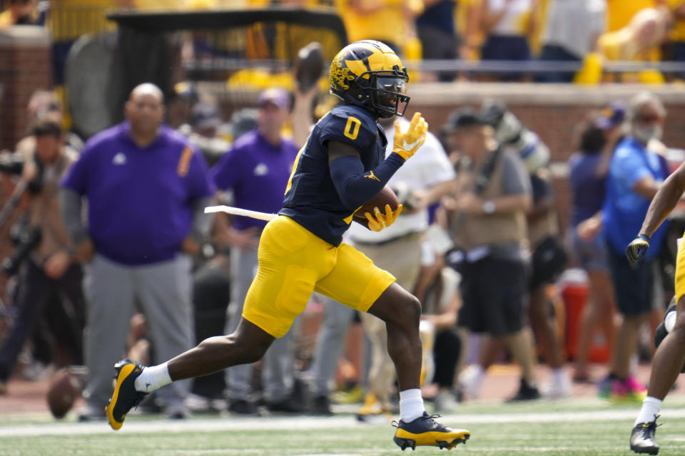 Michigan defensive back Mike Sainristil intercepts an East Carolina pass in the first half of an NCAA college football game in Ann Arbor, Mich., Saturday, Sept. 2, 2023. (AP Photo/Paul Sancya)