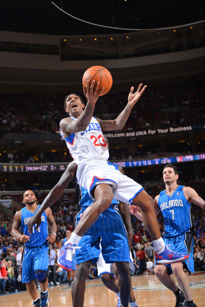 PHILADELPHIA, PA - APRIL 7: Louis Williams #23 of the Philadelphia 76ers goes to the basket against the Orlando Magic on April 7, 2012 at the Wells Fargo Center in Philadelphia, Pennsylvania. NOTE TO USER: User expressly acknowledges and agrees that, by downloading and/or using this Photograph, user is consenting to the terms and conditions of the Getty Images License Agreement. Mandatory Copyright Notice: Copyright 2012 NBAE