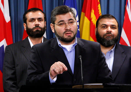 FILE PHOTO -- Abdullah Almalki (C), with Muayyed Nureddin (L) and Ahmad El Maati, speaks during a news conference on Parliament Hill in Ottawa October 12, 2007. REUTERS/Chris Wattie/File Photo