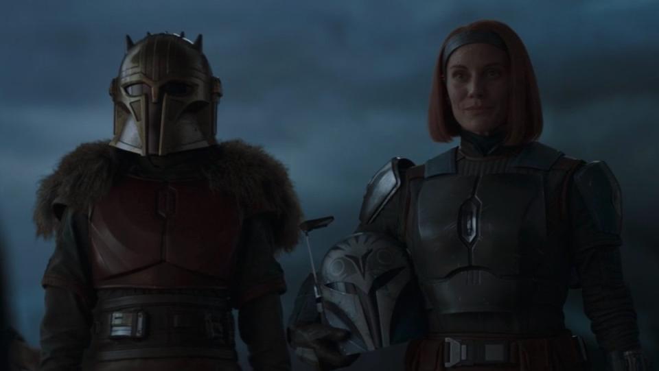 The Armorer stands next to Bo-Katan Kryce (not wearing a helmet) on The Mandalorian