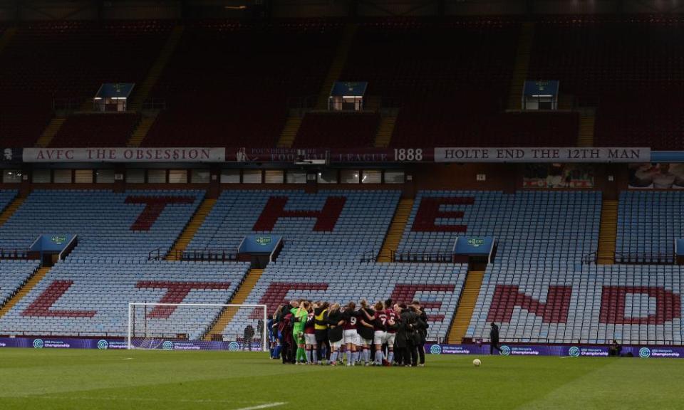 Aston Villa’s players gather in a huddle after the game.