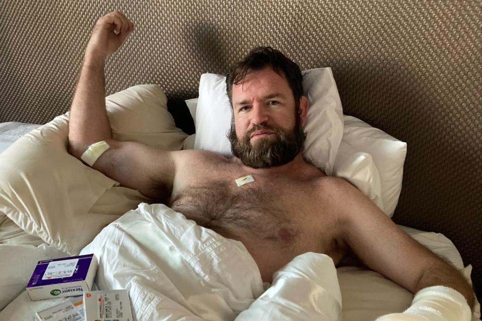 Steve recovering in bed after being stabbed (Lizzie Edmonds)