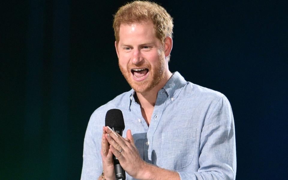 Duke of Sussex speaks onstage during the taping of the "Vax Live" fundraising concert  - AFP