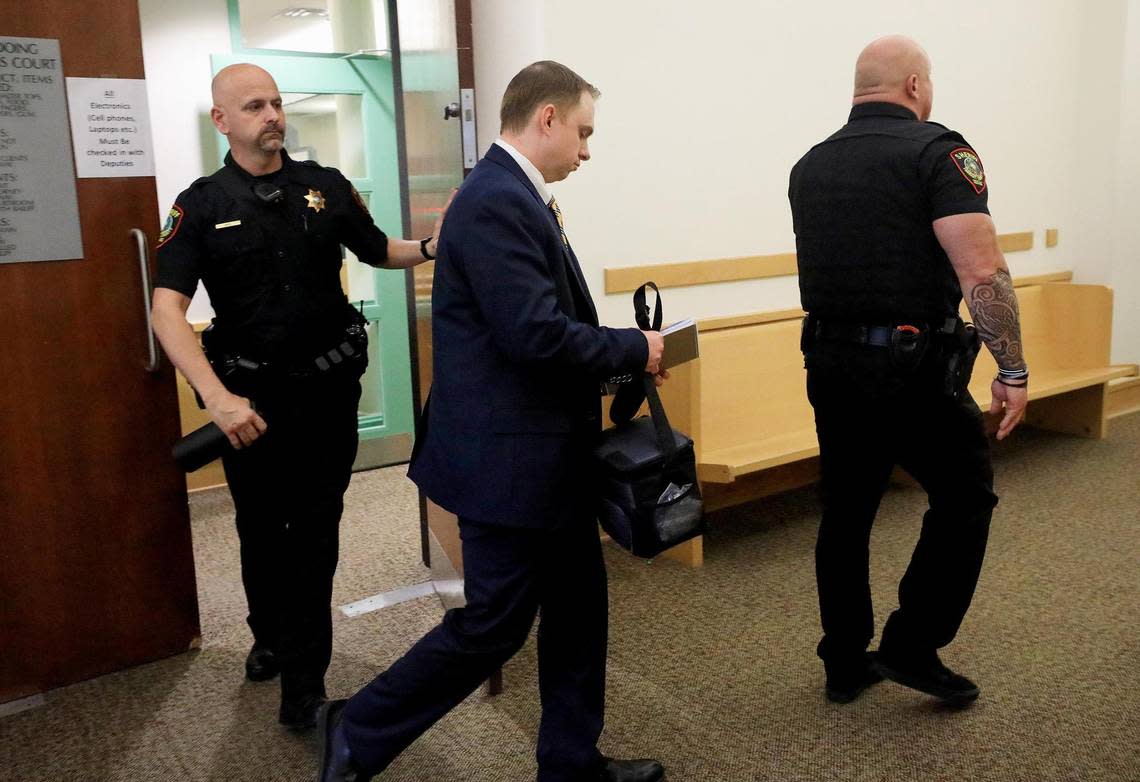 Aaron Dean, accused of the 2019 murder of Atatiana Jefferson, leaves the 396th District Court on Wednesday, December 7, 2022. The state has rested its case after three days of trial.