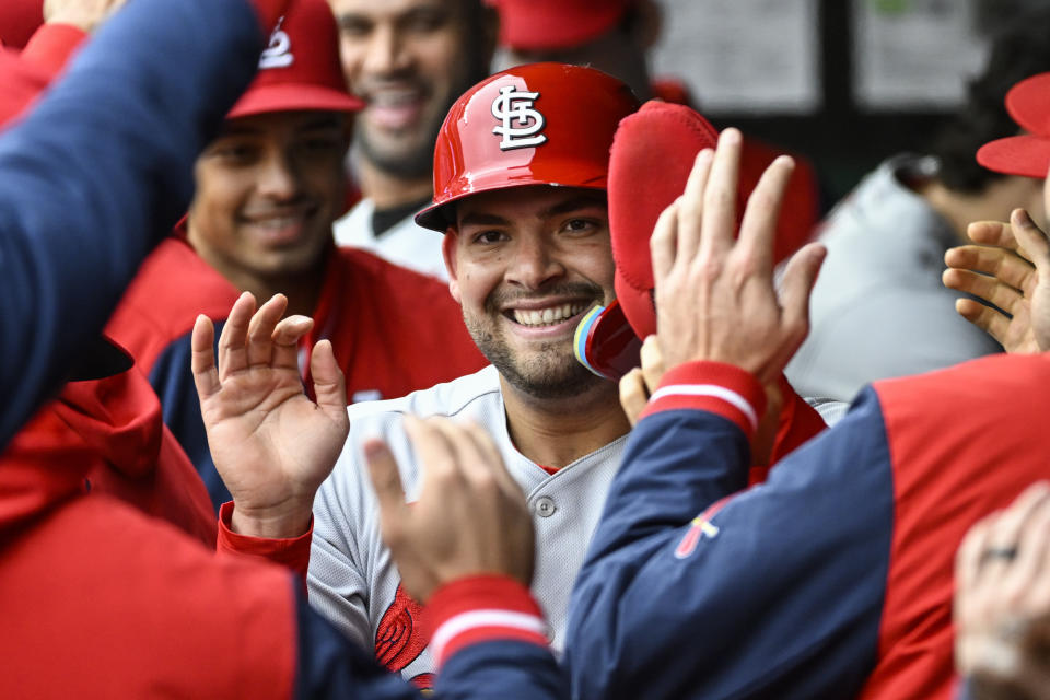 St. Louis Cardinals' Juan Yepez is congratulated in the dugout after scoring a run in the first inning of a baseball game against the Kansas City Royals, Wednesday, May 4, 2022 in Kansas City, Mo. (AP Photo/Reed Hoffmann)