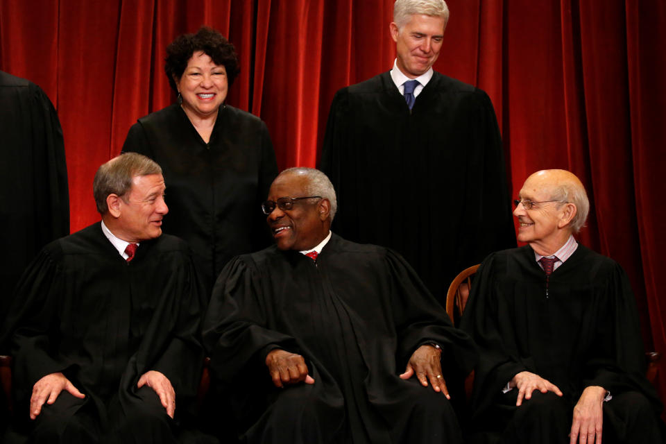 U.S. Chief Justice John Roberts (seated L-R), Justice Clarence Thomas, Justice Stephen Breyer, Justice Sonia Sotomayor (top L) and Justice Neil Gorsuch (top R) chat during a new U.S. Supreme Court family photo including Gorsuch, their most recent addition, at the Supreme Court building in Washington, D.C., U.S., June 1, 2017.&nbsp;