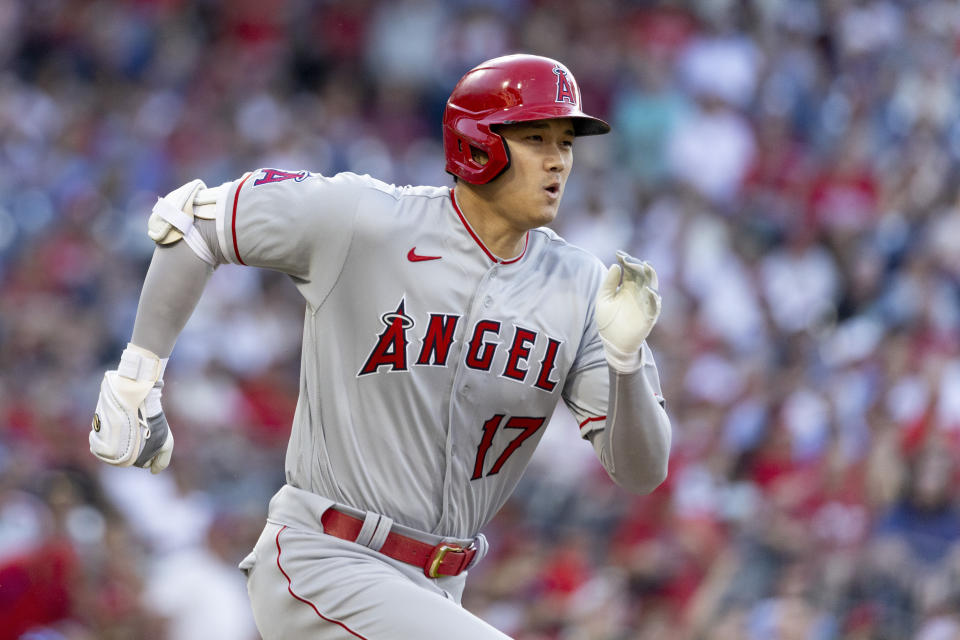 Los Angeles Angels' Shohei Ohtani runs to first base after hitting a single against the Philadelphia Phillies during the first inning of a baseball game Saturday, June 4, 2022, in Philadelphia. (AP Photo/Laurence Kesterson)