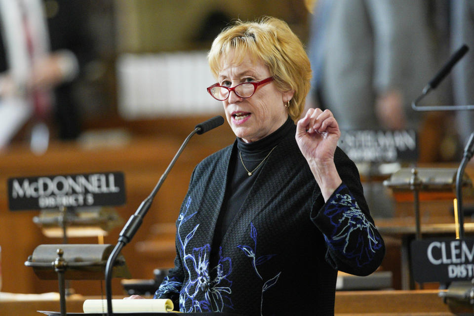 FILE - Nebraska state Sen. Lou Ann Linehan of Elkhorn speaks during debate in Lincoln, Neb., May 7, 2019. Nebraska lawmakers are on track to pass a bill that would circumvent Nebraska voters who could repeal a new Nebraska law that funds private school tuition with taxpayer money. The bill by Omaha Sen. Lou Ann Linehan advanced Tuesday from the first of three rounds of debate. (AP Photo/Nati Harnik, File)