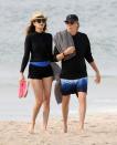 <p>Paul McCartney and wife Nancy Shevell color coordinate on July 29 while strolling along the beach in The Hamptons, New York.</p>