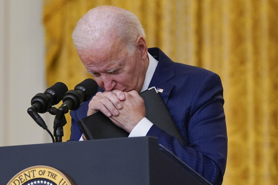 FILE - President Joe Biden pauses as he listens to a question about the bombings at the Kabul airport that killed at least 12 U.S. service members, from the East Room of the White House, on Aug. 26, 2021, in Washington. (AP Photo/Evan Vucci)