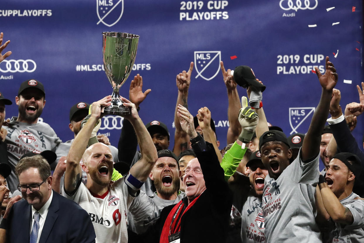 A first-half goal from Nicolas Benezet and and late stunner from Nick DeLeon lifted Toronto FC to its third Eastern Conference title in four years. (AP)