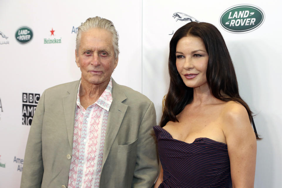 Michael Douglas, left, and Catherine Zeta-Jones arrive at the 2019 Primetime Emmy Awards - BAFTA Los Angeles TV Tea Party at the Beverly Hilton on Saturday, Sept. 21, 2019, in Beverly Hills, Calif. (Photo by Willy Sanjuan/Invision/AP)