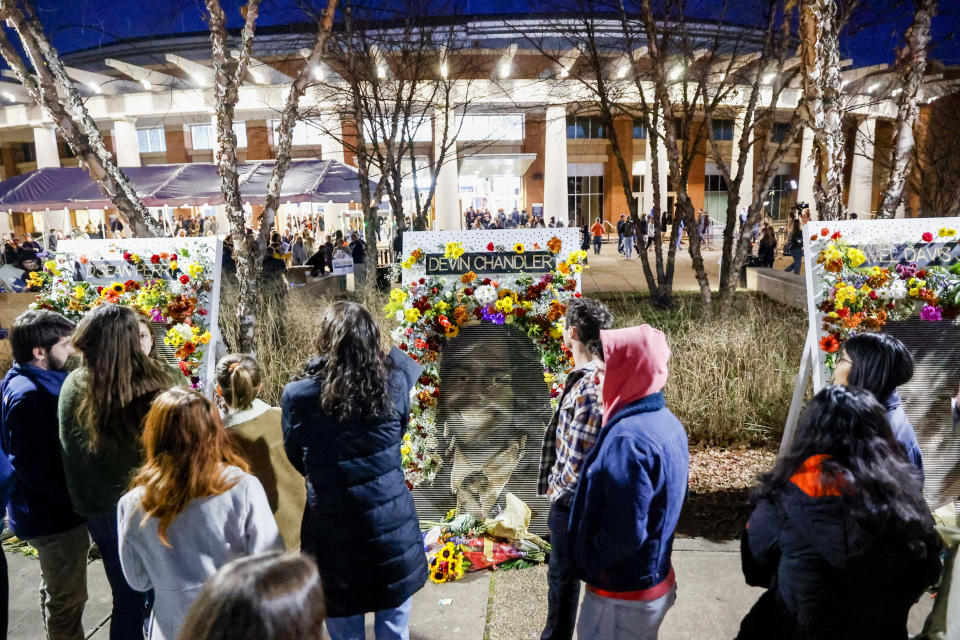 Community members attend a memorial service on Saturday, Nov. 19, 2022, at John Paul Jones Arena on the campus of the University of Virginia in Charlottesville, Va., for three slain University of Virginia football players, who were fatally shot as they returned from a field trip last weekend. (Shaban Athuman/Richmond Times-Dispatch via AP)