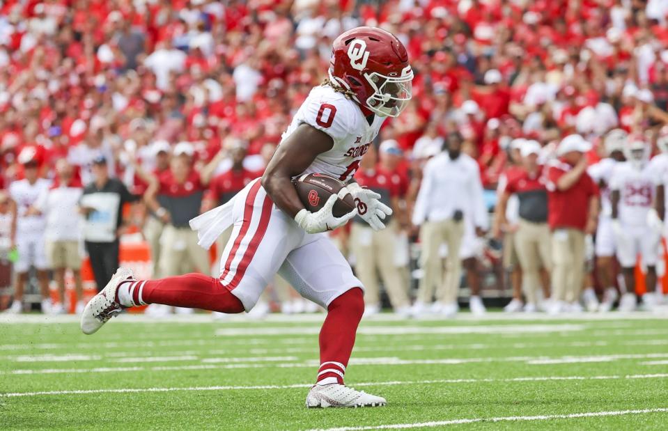 Sep 17, 2022; Lincoln, Nebraska, USA;  Oklahoma Sooners running back Eric Gray (0) runs for a touchdown during the first half against the Nebraska Cornhuskers at Memorial Stadium. Mandatory Credit: Kevin Jairaj-USA TODAY Sports