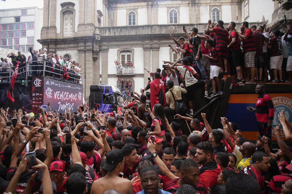 Players of Brazil's Flamengo parade at their arrival in Rio de Janeiro, Brazil, Sunday, Nov. 24, 2019. Flamengo overcame Argentina's River Plate 2-1 in the Copa Libertadores final match on Saturday in Lima to win its second South American title. (AP Photo/Ricardo Borges)