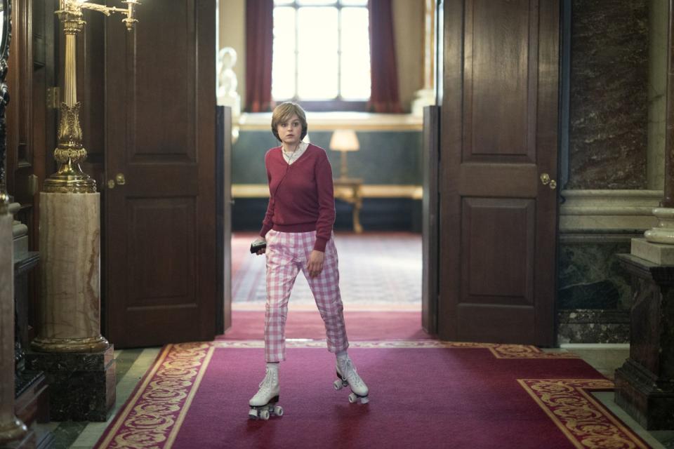 Princess-to-be Diana (Emma Corrin) skates through the halls of Buckingham Palace in "The Crown."