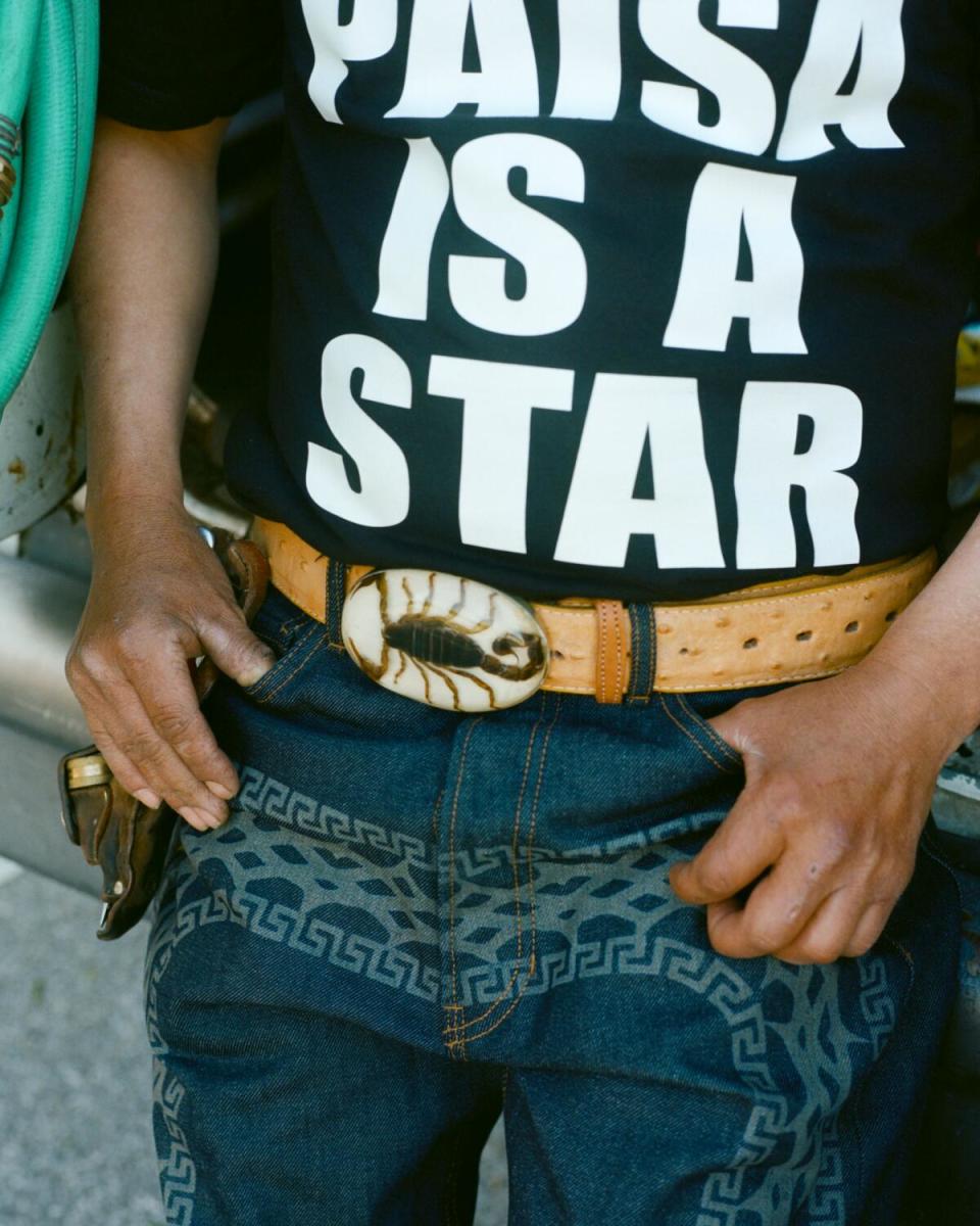 Landscaper wears Paisaboys Charro/Psycho denim, Paisaboys "EVERY PAISA IS A STAR" shirt and Paisaboys Cachucha de Jardinero.