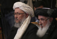 Taliban official Abdul Salam Hanafi, left, attends talks involving Afghan representatives in Moscow, Russia, Wednesday, Oct. 20, 2021. Russia invited the Taliban and other Afghan parties for talks voicing hope they will help encourage discussions and tackle Afghanistan's challenges. (AP Photo/Alexander Zemlianichenko, Pool)