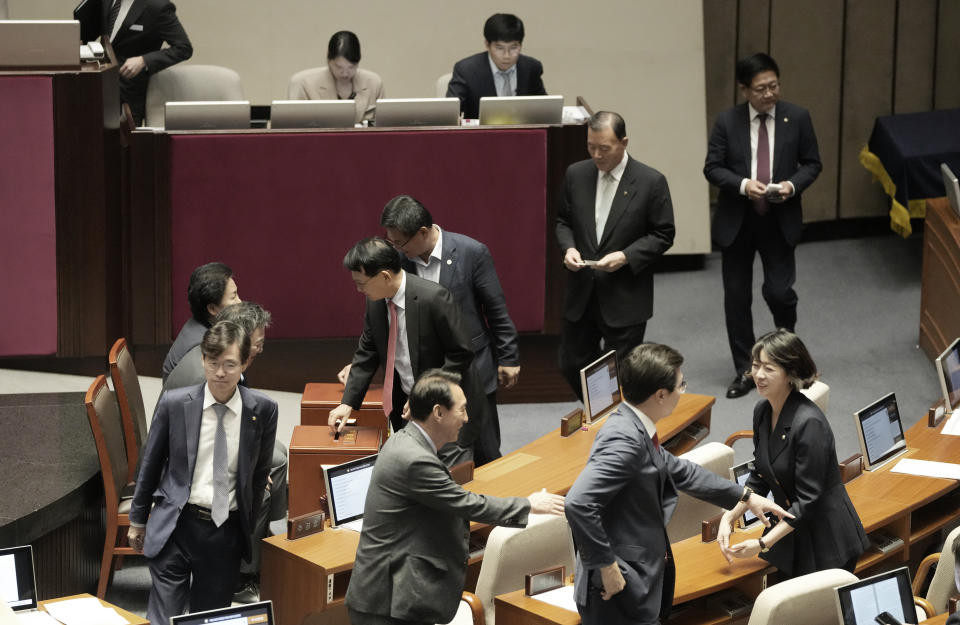 Lawmakers cast ballots at the National Assembly in Seoul, South Korea, Thursday, Sept. 21, 2023. In a surprise outcome, South Korea’s opposition-controlled parliament on Thursday voted to pass a motion submitted by the government that allows for the potential arrest of the country’s leading opposition figure, Lee Jae-myung, who faces a widening investigation over corruption allegations.(AP Photo/Ahn Young-joon)