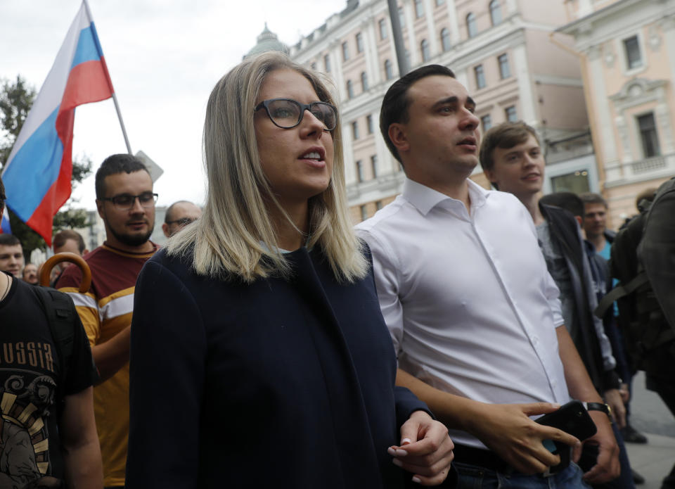 Russian opposition candidate and lawyer at the Foundation for Fighting Corruption Lyubov Sobol, center, attends a protest in Moscow, Russia, Sunday, July 14, 2019. Opposition candidates who run for seats in the city legislature in September's elections have complained that authorities try to bar them from the race by questioning the validity of signatures of city residents they must collect in order to qualify for the race. (AP Photo/Pavel Golovkin)