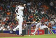 Jul 9, 2018; Houston, TX, USA; Houston Astros relief pitcher Brad Peacock (41) reacts and Oakland Athletics right fielder Stephen Piscotty (25) rounds the bases after hitting a home run during the seventh inning at Minute Maid Park. Mandatory Credit: Troy Taormina-USA TODAY Sports