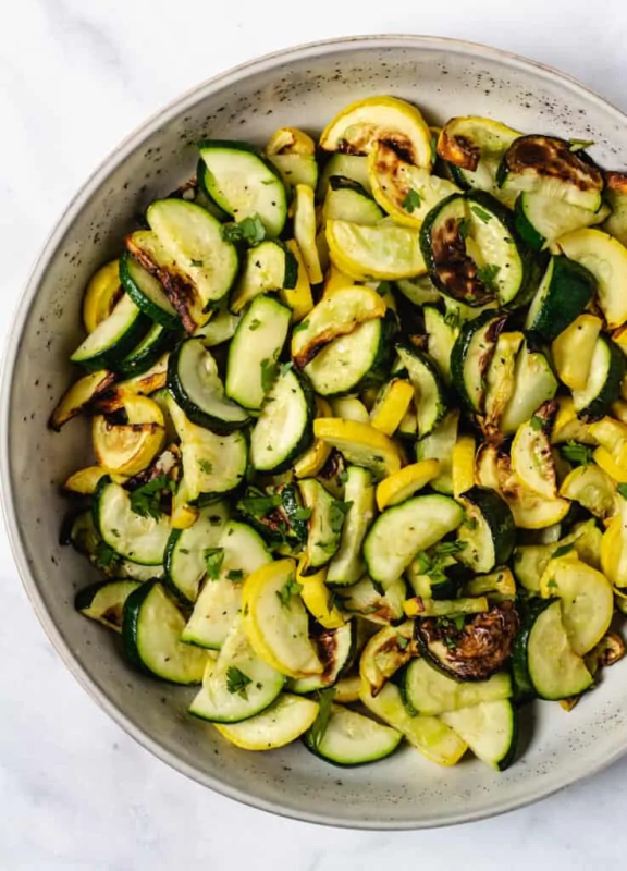 <p>Keeping the Peas</p><p>This easy Air Fryer Squash recipe is made with zucchini and yellow squash lightly seasoned and tossed in garlic to create a golden brown side dish in minutes!</p><p><strong>Get the recipe: </strong><a href="https://www.keepingthepeas.com/air-fryer-sqush/" rel="nofollow noopener" target="_blank" data-ylk="slk:Air Fryer Squash: Zucchini and Yellow Squash Recipe;elm:context_link;itc:0;sec:content-canvas" class="link "><strong>Air Fryer Squash: Zucchini and Yellow Squash Recipe</strong></a></p>