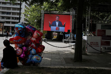 A screen displays a speech of Greek Prime Minister Alexis Tsipras at the European Union elections kiosk of ruling Syriza party in Athens, Greece, May 24, 2019. REUTERS/Alkis Konstantinidis