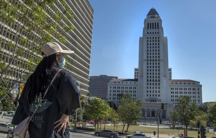 LOS ANGELES, CA - OCTOBER 14, 2021: Overall, shows Los Angeles City Hall on Spring St. in downtown Los Angeles as seen from Grand Park. Los Angeles will officially require its city workers to be vaccinated against COVID-19 as the vaccination and reporting rules become "conditions of city employment," according to its ordinance. But it remains unclear what will happen to those who have refused to get the shots. (Mel Melcon / Los Angeles Times)