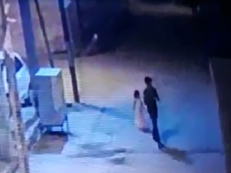 Girl aged six seen on CCTV being led away to her rape and murder in India