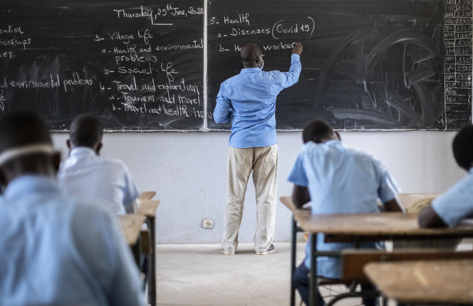 Senegalese students learn about health and the coronavirus during an English lesson as they returned to classes on the first day back after more than three months away, at the Sacre Coeur college in Dakar, Senegal Thursday, June 25, 2020. (AP Photo/Sylvain Cherkaoui)