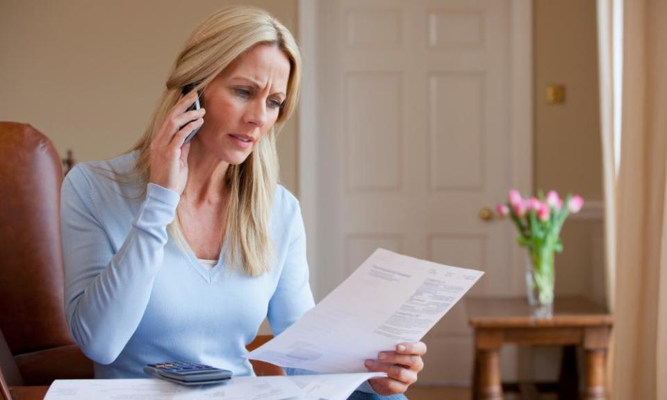 A concerned woman on a phone