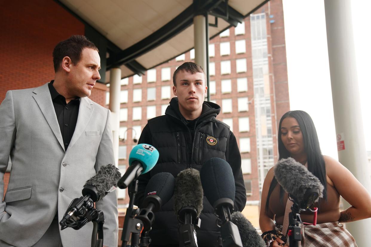 Jordan Trengove (centre), who was accused of trafficking by Eleanor Williams, speaking to the media outside Preston Crown Court, Lancashire, where she was jailed for eight-and-a-half years for nine counts of perverting the course of justice after she claimed to have been the victim of an Asian grooming gang. Williams, 22, published pictures of her injuries and an account of being groomed, trafficked and beaten, on Facebook in May 2020, in a post which was shared more than 100,000 times. Picture date: Tuesday March 14, 2023.