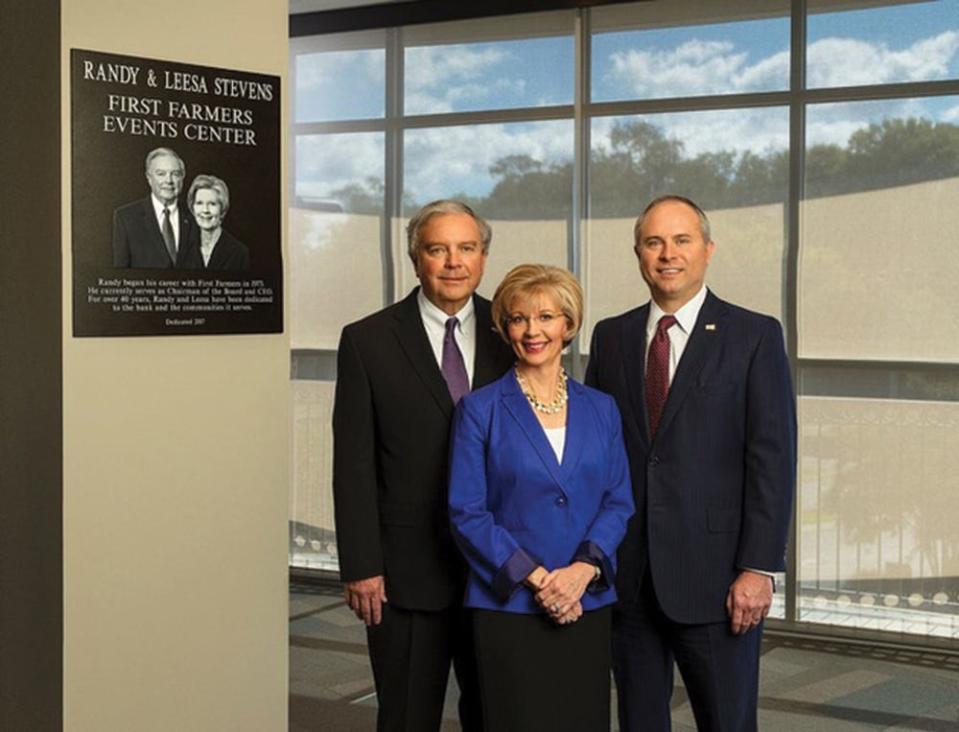 First Farmers CEO T. Randy Stevens, left, Leesa Stevens and First Farmers President Brian Williams stand outside the Randy & Leesa Stevens First Farmers Events Center, 901 Nashville Highway in Columbia. The bank named the special-events space in honor of the couple in September in 2017.