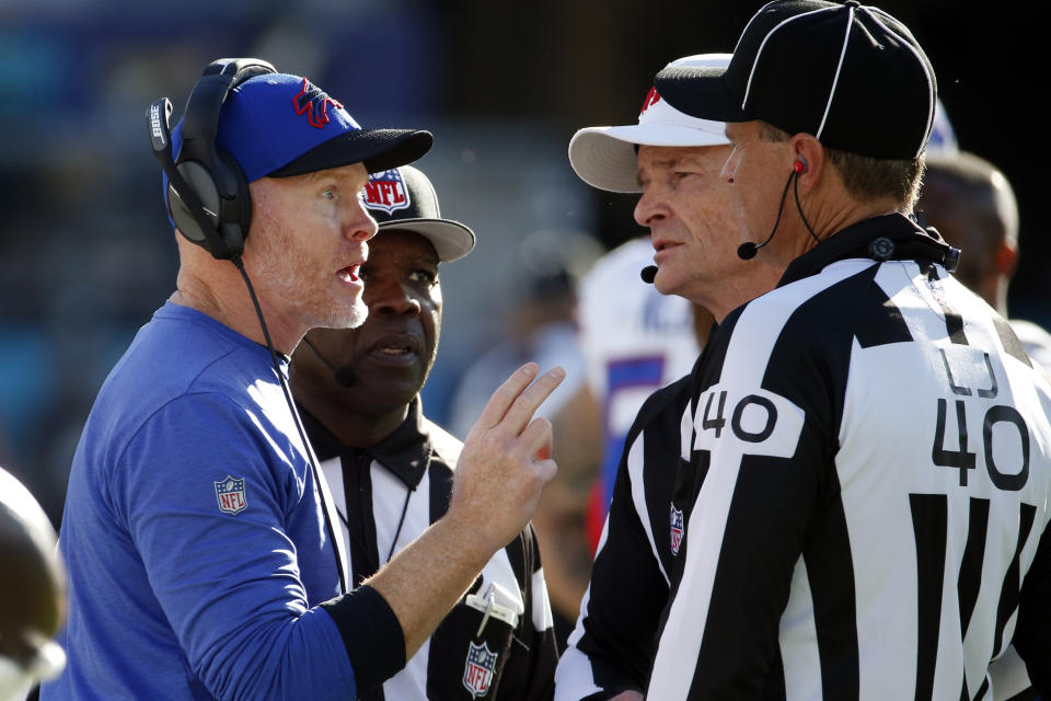 Buffalo Bills head coach Sean McDermott, left, makes a points with officials including line judge Brian Bolinger (40) during the second half of an NFL football game, Sunday, Nov. 7, 2021, in Jacksonville, Fla. (AP Photo/Stephen B. Morton)