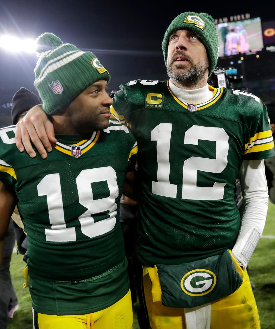 Aaron Rodgers and Randall Cobb walk off the field following the Packers' season-ending loss the Lions on Jan. 8, 2023.