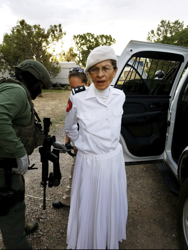 FILE - In this Aug. 20, 2017 file photo provided by the Cibola County Sheriff's Office, Deborah Green, leader of a New Mexico paramilitary religious sect, is arrested outside of the group's secluded Fence Lake, N.M. compound. Green has been sentenced to more than seven decades in prison after her conviction in a child sex abuse case. (Cibola County Sheriff's Office via AP, File)