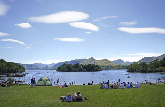 People enjoy the weather at Derwentwater in the Lake District National Park near Keswick 