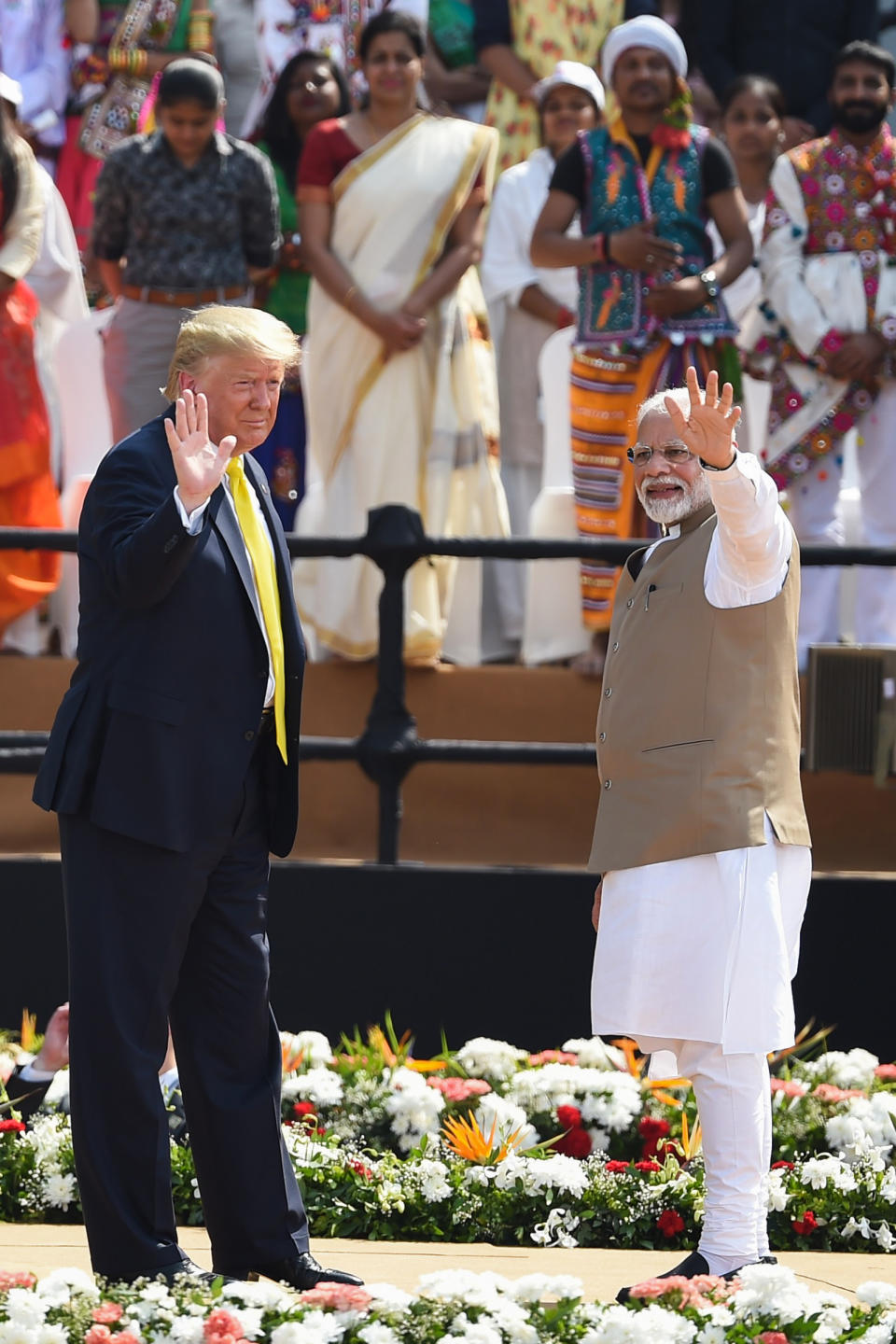 India's Prime Minister Narendra Modi (R) and US President Donald Trump wave at the crowd during 'Namaste Trump' rally at Sardar Patel Stadium in Motera, on the outskirts of Ahmedabad, on February 24, 2020. (Photo by Money SHARMA / AFP) (Photo by MONEY SHARMA/AFP via Getty Images)