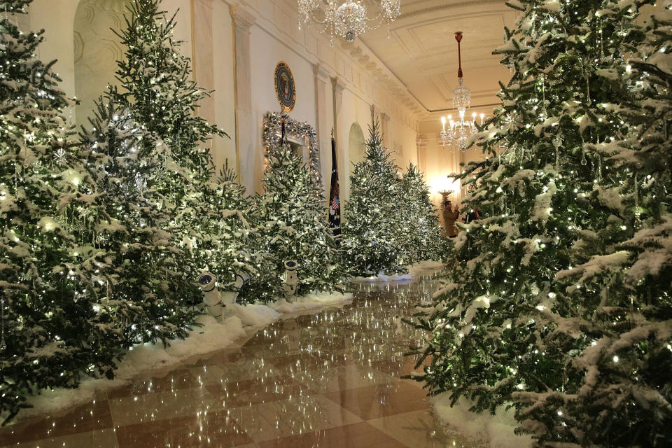 <p>The Cross Hall at the White House during a press preview of the 2017 holiday decorations Nov. 27, 2017 in Washington, D.C. The theme of the White House holiday decorations this year is “Time-Honored Traditions.” (Photo: Alex Wong/Getty Images) </p>