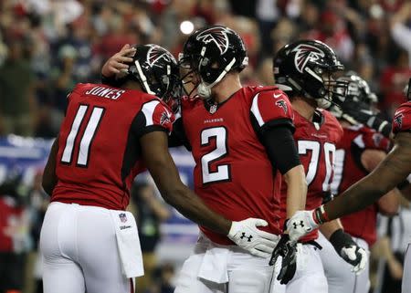 Jan 14, 2017; Atlanta, GA, USA; Atlanta Falcons wide receiver Julio Jones (11) celebrates with quarterback Matt Ryan (2) after scoring a touchdown against the Seattle Seahawks during the second quarter in the NFC Divisional playoff at Georgia Dome. Mandatory Credit: Jason Getz-USA TODAY Sports