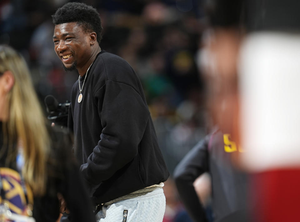 Miami Heat center Thoms Bryant walks off the court after receiving his NBA championship ring before the Heat's basketball game against the Denver Nuggets on Thursday, Feb. 29, 2024, in Denver. (AP Photo/David Zalubowski)