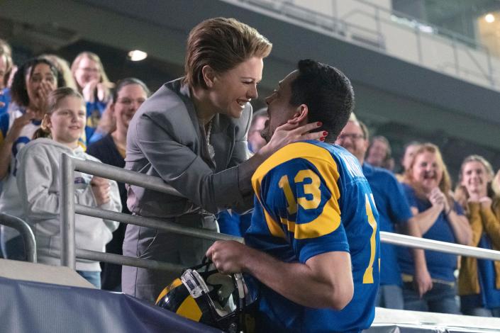 Kurt Warner (Zachary Levi, right) celebrates his big NFL moment with his wife Brenda (Anna Paquin) in &quot;American Underdog.&quot;