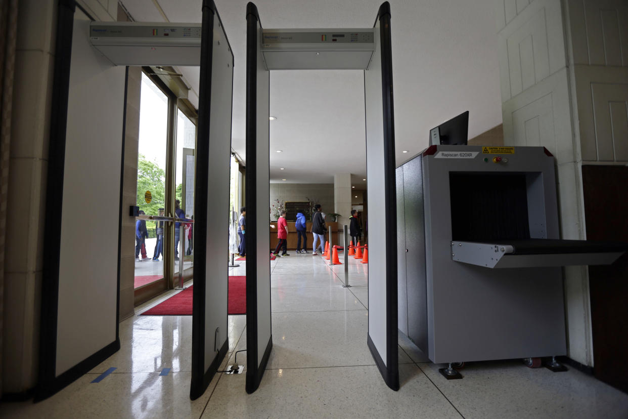 A group of school kids make their way past soon-to-be utilized security equipment into the Legislative Building in Raleigh, N.C., in this photo taken April 23, 2018.